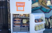 An open small refrigerator door with "Cheetah" in orange logo. The fridge has bread, juice, and eggs.
